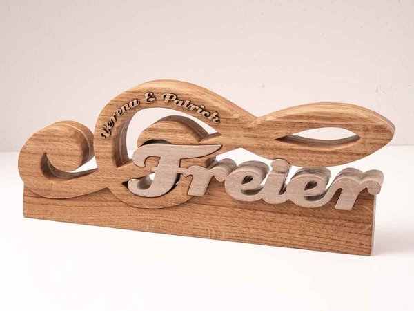 Notenschlüssel aus Holz mit Familien Name